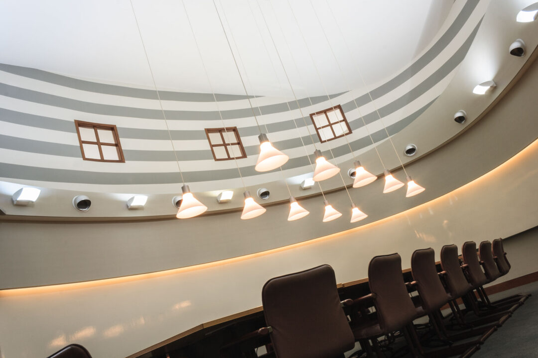 Circular office with pendant lights.